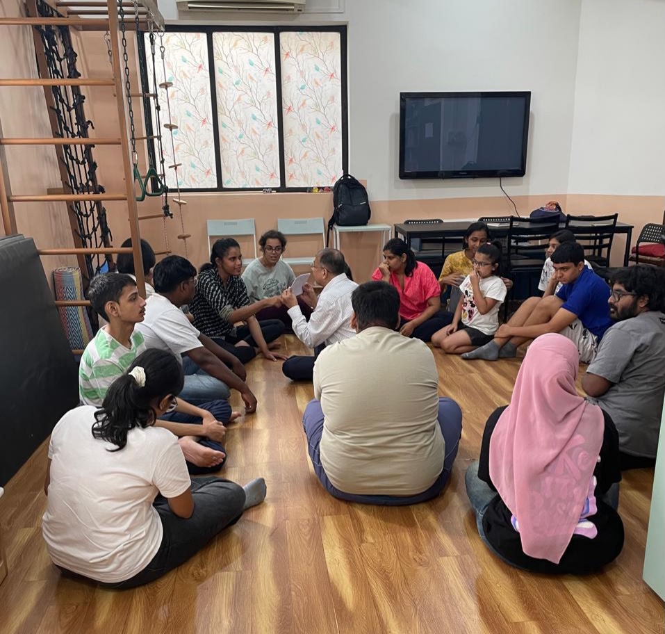 Imaginasium participants and facilitators in a group circle session